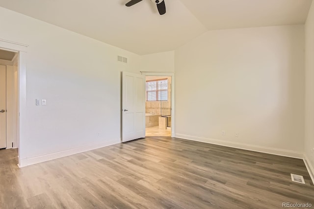 19259 E Caspian Pl, Aurora, CO 80013 - unfurnished room featuring wood finished floors, a ceiling fan, and vaulted ceiling