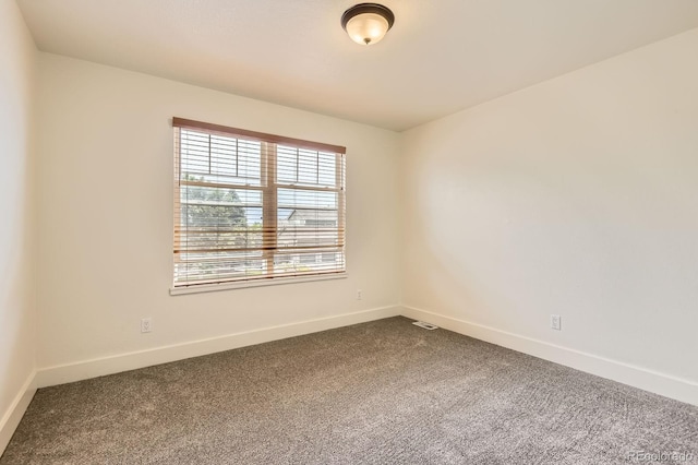 19259 E Caspian Pl, Aurora, CO 80013 - unfurnished room featuring dark colored carpet