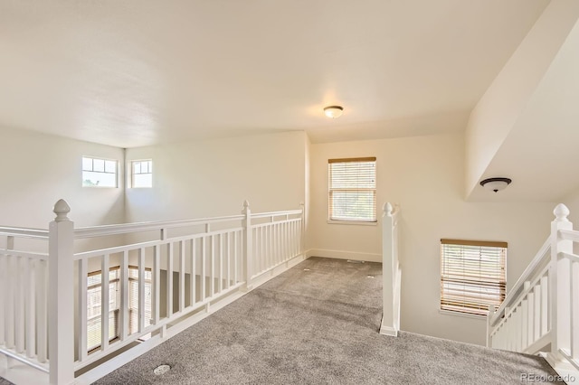 19259 E Caspian Pl, Aurora, CO 80013 - hall featuring an upstairs landing, carpet flooring, and plenty of natural light