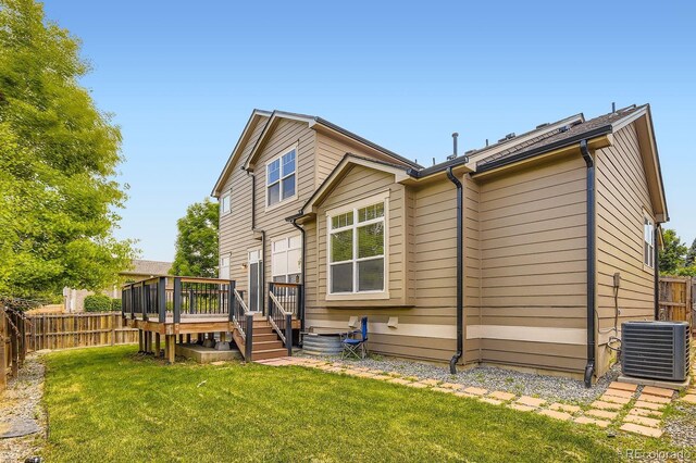 19259 E Caspian Pl, Aurora, CO 80013 - back of house featuring a wooden deck and a fenced backyard