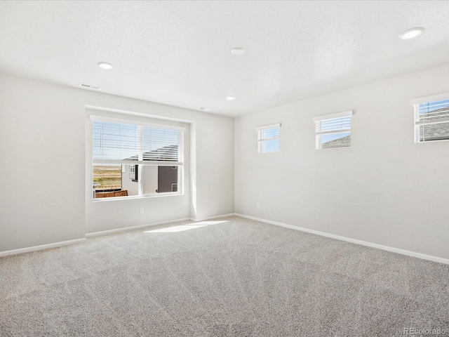 empty room featuring carpet flooring