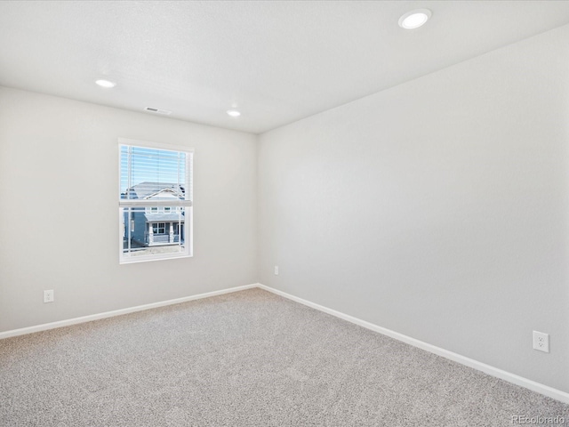 unfurnished room with carpet flooring