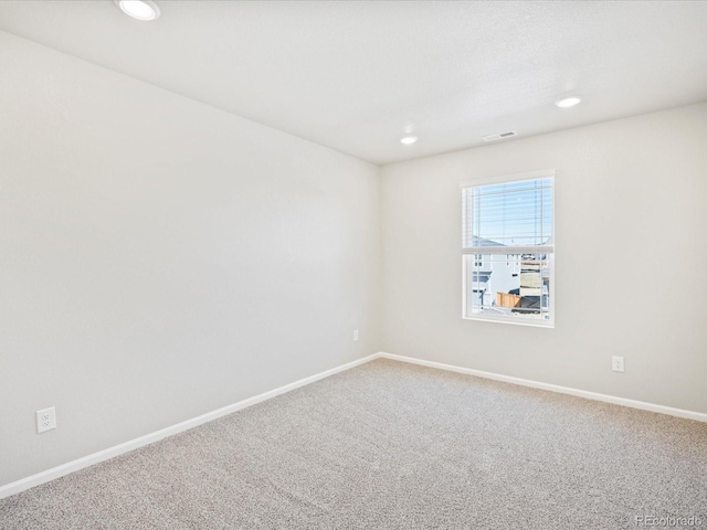 spare room featuring carpet floors