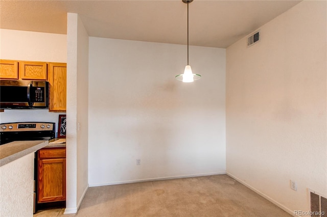 908 S Yampa St Unit 208, Aurora, CO 80017 - unfurnished dining area featuring light carpet and baseboards