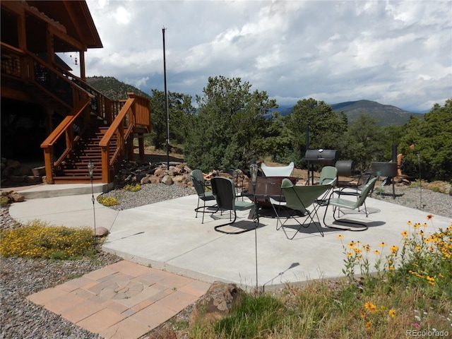 view of patio / terrace featuring a mountain view