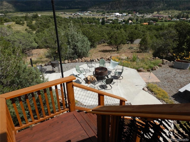 wooden terrace featuring a patio