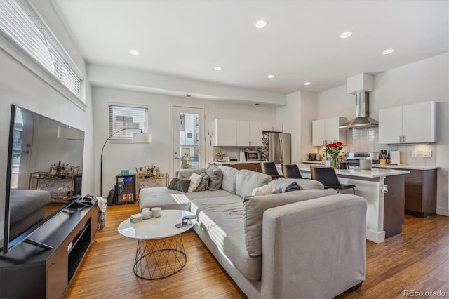 living room with light hardwood / wood-style floors