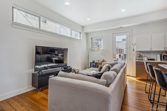 living room with light hardwood / wood-style flooring