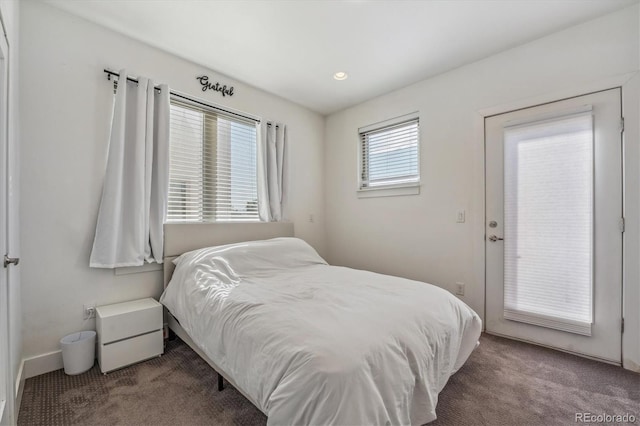 bedroom featuring carpet floors and baseboards