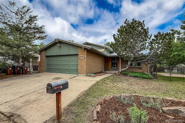 3722 Monterey Pl, Boulder, CO 80301 - view of front of property featuring a garage, driveway, and brick siding