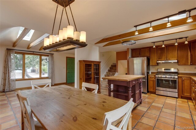 3722 Monterey Pl, Boulder, CO 80301 - dining space featuring light tile patterned floors, a skylight, stairway, and track lighting