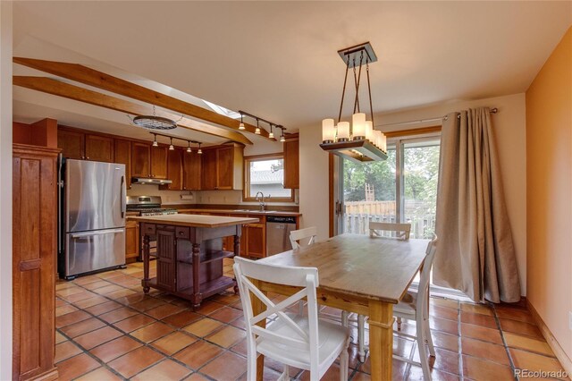 3722 Monterey Pl, Boulder, CO 80301 - dining space with rail lighting and light tile patterned floors