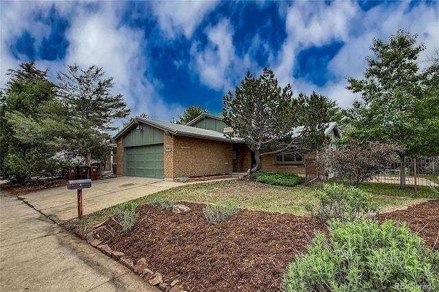 3722 Monterey Pl, Boulder, CO 80301 - view of front of home featuring brick siding, concrete driveway, an attached garage, and board and batten siding