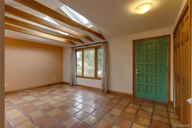 3722 Monterey Pl, Boulder, CO 80301 - entryway with a skylight, light tile patterned floors, and beam ceiling