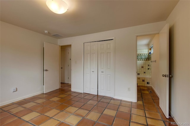3722 Monterey Pl, Boulder, CO 80301 - unfurnished bedroom featuring light tile patterned floors and a closet