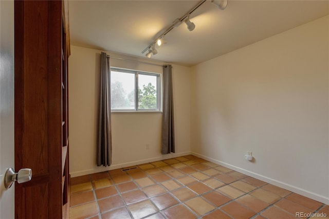 3722 Monterey Pl, Boulder, CO 80301 - unfurnished room featuring track lighting and light tile patterned floors