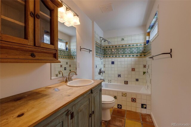 3722 Monterey Pl, Boulder, CO 80301 - bathroom featuring tiled shower / bath combo, vanity, healthy amount of natural light, and tile patterned floors