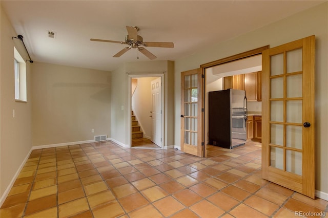 3722 Monterey Pl, Boulder, CO 80301 - unfurnished room featuring stairway, ceiling fan, and light tile patterned floors