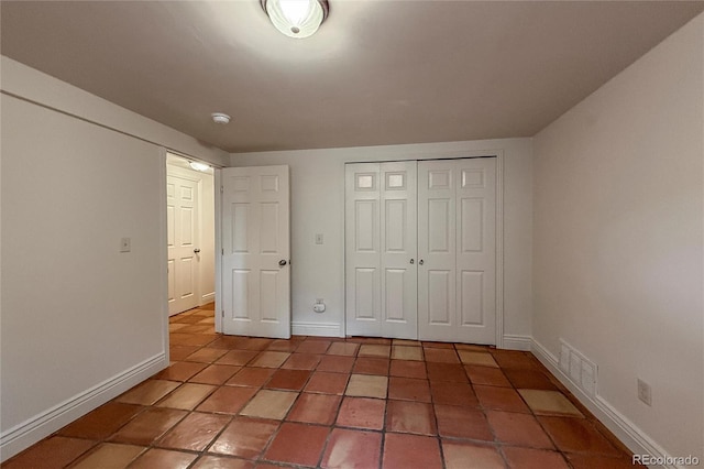 3722 Monterey Pl, Boulder, CO 80301 - unfurnished bedroom featuring a closet and tile patterned floors