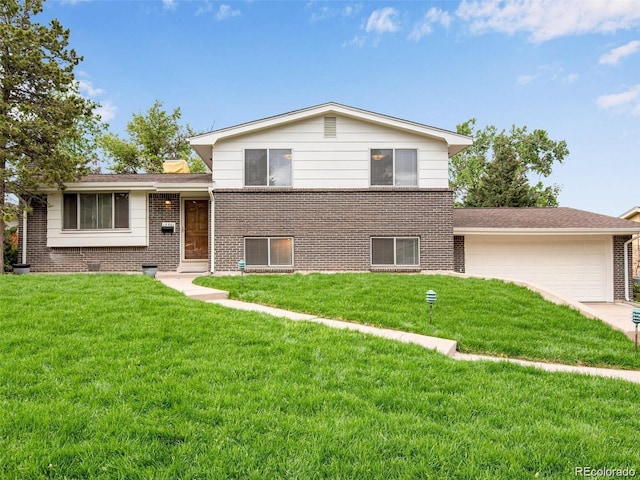 13561 W Alaska Pl, Lakewood, CO 80228 - tri-level home featuring an attached garage and brick siding