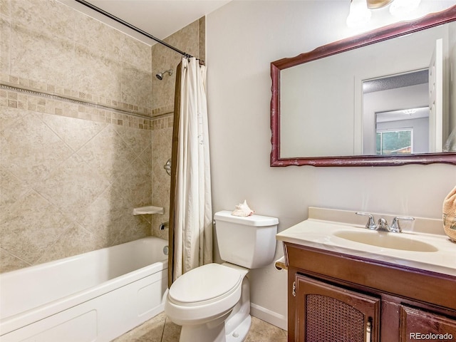 13561 W Alaska Pl, Lakewood, CO 80228 - full bathroom with baseboards, toilet, vanity, shower / tub combo, and tile patterned flooring