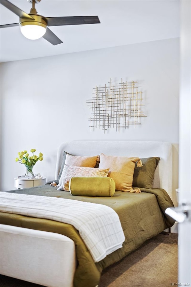 carpeted bedroom with a ceiling fan