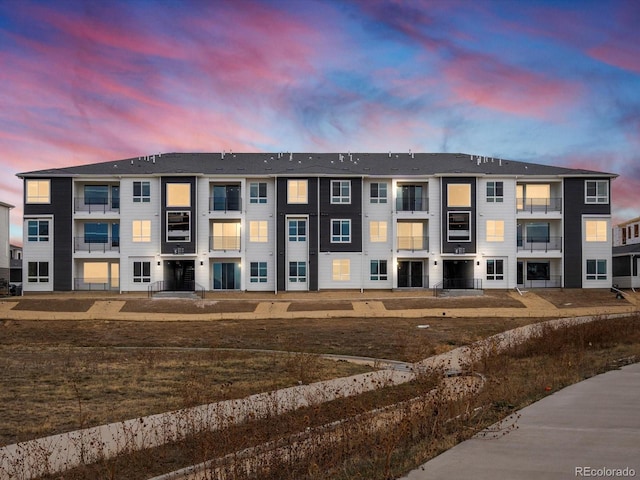 view of outdoor building at dusk