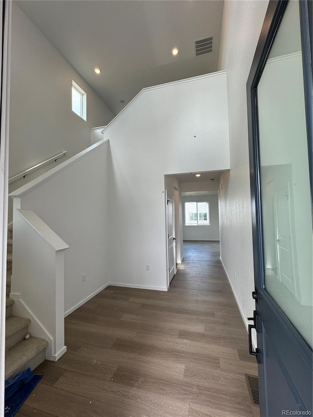 2142 S Irvington St, Aurora, CO 80018 - hallway with wood finished floors, stairs, recessed lighting, and baseboards