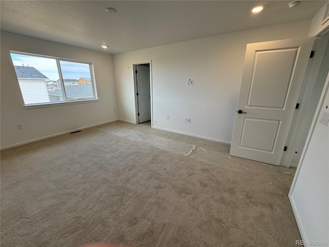 2142 S Irvington St, Aurora, CO 80018 - unfurnished room featuring light carpet, recessed lighting, and baseboards