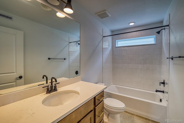 2142 S Irvington St, Aurora, CO 80018 - bathroom featuring tub / shower combination, vanity, a textured ceiling, and tile patterned floors