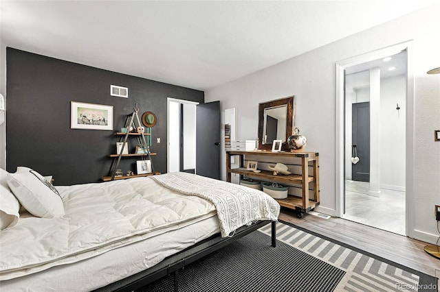 960 N Pennsylvania St Unit 6, Denver, CO 80203 - bedroom with wood finished floors and ensuite bath