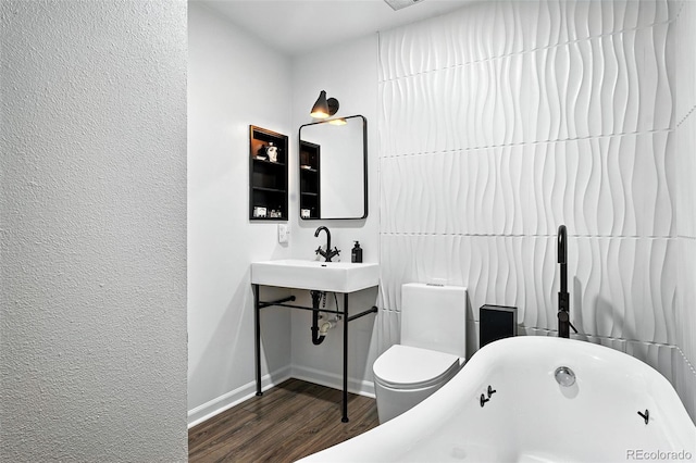960 N Pennsylvania St Unit 6, Denver, CO 80203 - full bathroom with a freestanding tub and wood finished floors
