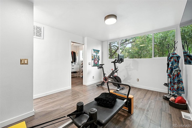 960 N Pennsylvania St Unit 6, Denver, CO 80203 - workout room featuring wood finished floors and baseboards
