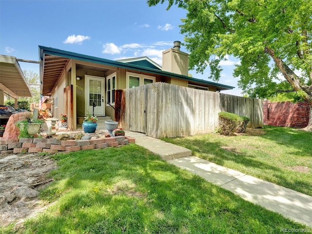 8730 E Roundtree Ave, Greenwood Village, CO 80111 - view of front of home featuring a chimney
