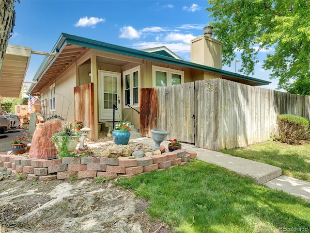 8730 E Roundtree Ave, Greenwood Village, CO 80111 - view of side of home with a chimney