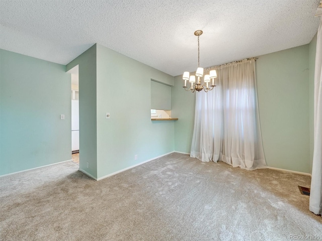 8730 E Roundtree Ave, Greenwood Village, CO 80111 - carpeted empty room featuring a chandelier, a textured ceiling, and baseboards