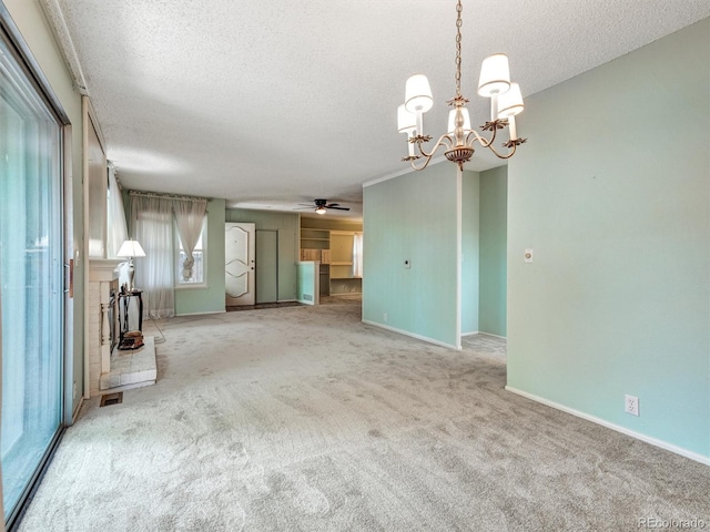 8730 E Roundtree Ave, Greenwood Village, CO 80111 - unfurnished living room featuring a textured ceiling, carpet, a chandelier, a ceiling fan, and baseboards