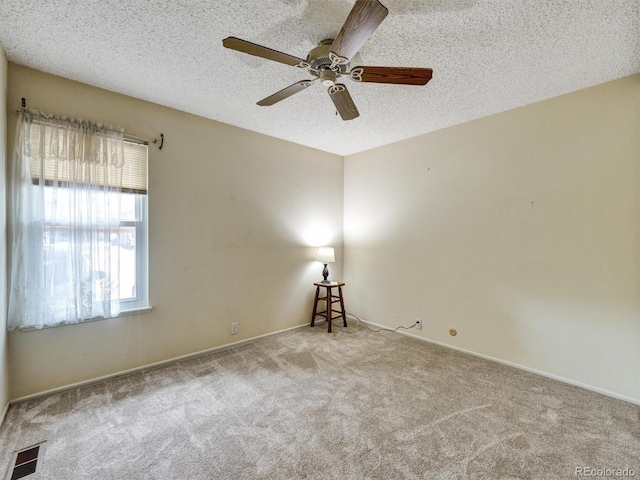 8730 E Roundtree Ave, Greenwood Village, CO 80111 - carpeted empty room featuring a ceiling fan, a textured ceiling, and baseboards