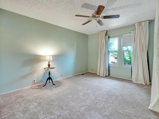 8730 E Roundtree Ave, Greenwood Village, CO 80111 - carpeted empty room with a textured ceiling, ceiling fan, and baseboards