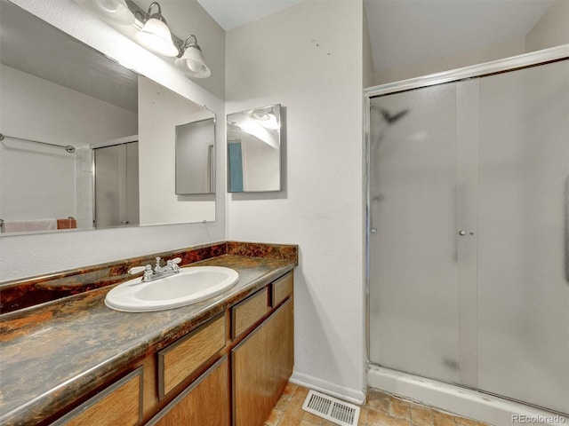 8730 E Roundtree Ave, Greenwood Village, CO 80111 - bathroom with a shower stall, vanity, and baseboards