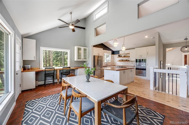 dining space featuring high vaulted ceiling, light tile patterned flooring, recessed lighting, baseboard heating, and built in study area