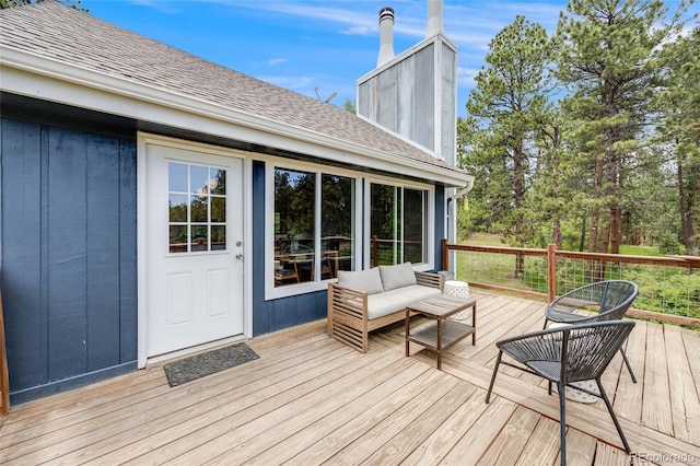 wooden deck featuring an outdoor hangout area