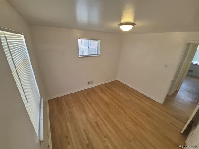 588 Empire St, Aurora, CO 80010 - unfurnished bedroom with light wood-style flooring and baseboards