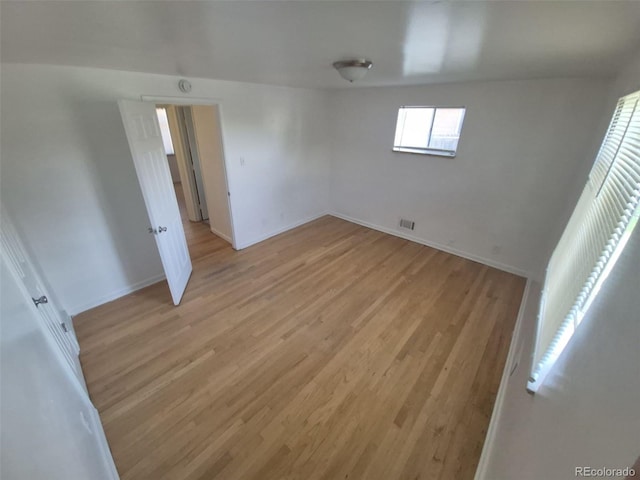 588 Empire St, Aurora, CO 80010 - unfurnished bedroom with light wood-style flooring and baseboards
