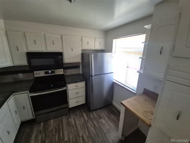 588 Empire St, Aurora, CO 80010 - kitchen with electric range, freestanding refrigerator, black microwave, white cabinets, and dark wood-style flooring