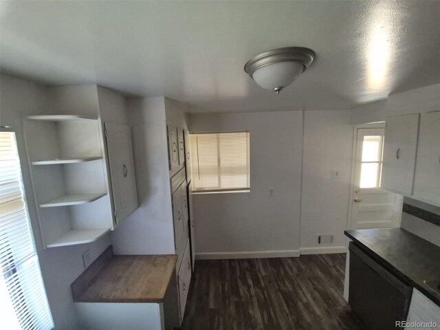 588 Empire St, Aurora, CO 80010 - kitchen featuring open shelves, baseboards, and dark wood finished floors
