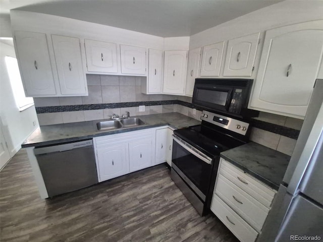 588 Empire St, Aurora, CO 80010 - kitchen featuring stainless steel appliances, a sink, white cabinetry, and dark wood-type flooring