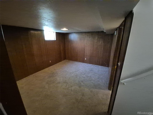 588 Empire St, Aurora, CO 80010 - basement featuring wooden walls and carpet flooring