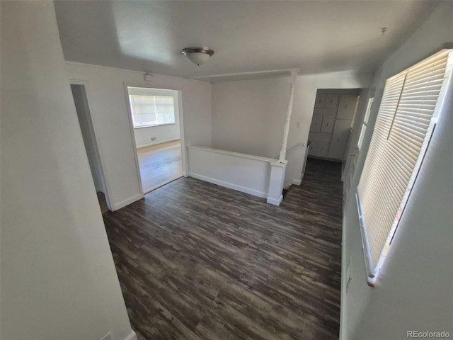 588 Empire St, Aurora, CO 80010 - empty room with dark wood-type flooring and baseboards