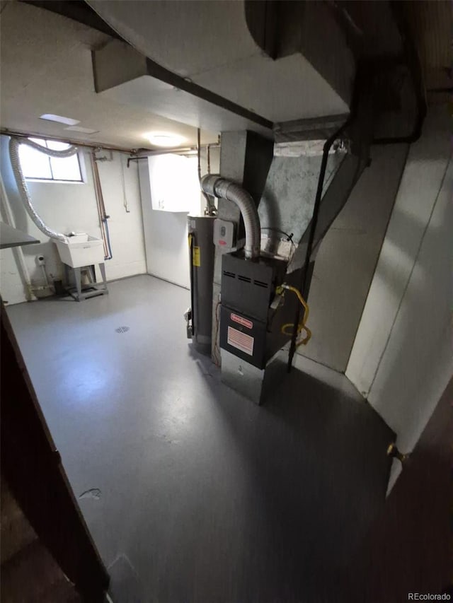 588 Empire St, Aurora, CO 80010 - basement featuring gas water heater and a sink